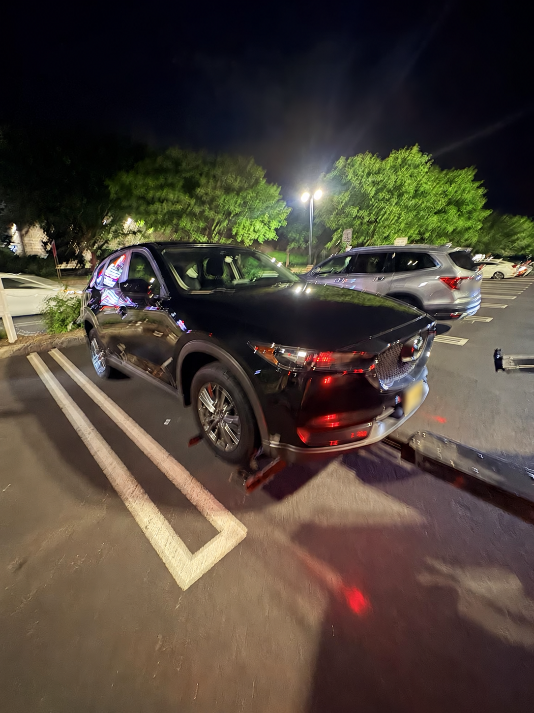 SUV being prepared for an authorized private-property tow in Bridgewater, New Jersey.